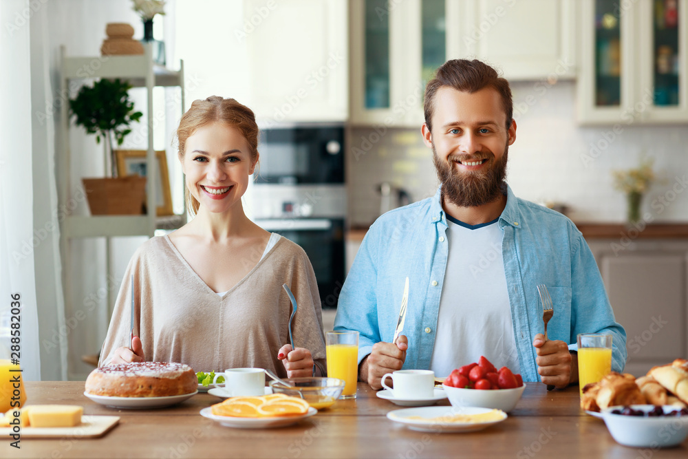 family happy couple have Breakfast in kitchen in morning. family happy couple have Breakfast in kitchen in morning.