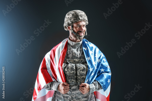 Soldier with national flag ...