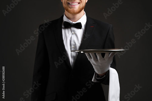 Handsome waiter with empty ...
