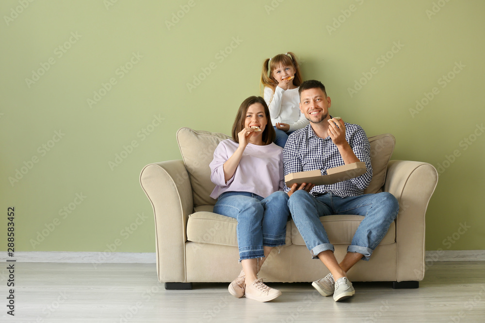 Happy family eating pizza at home Happy family eating pizza at home