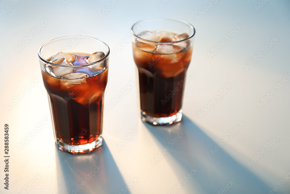Glasses of cold cola on light background Glasses of cold cola on light background