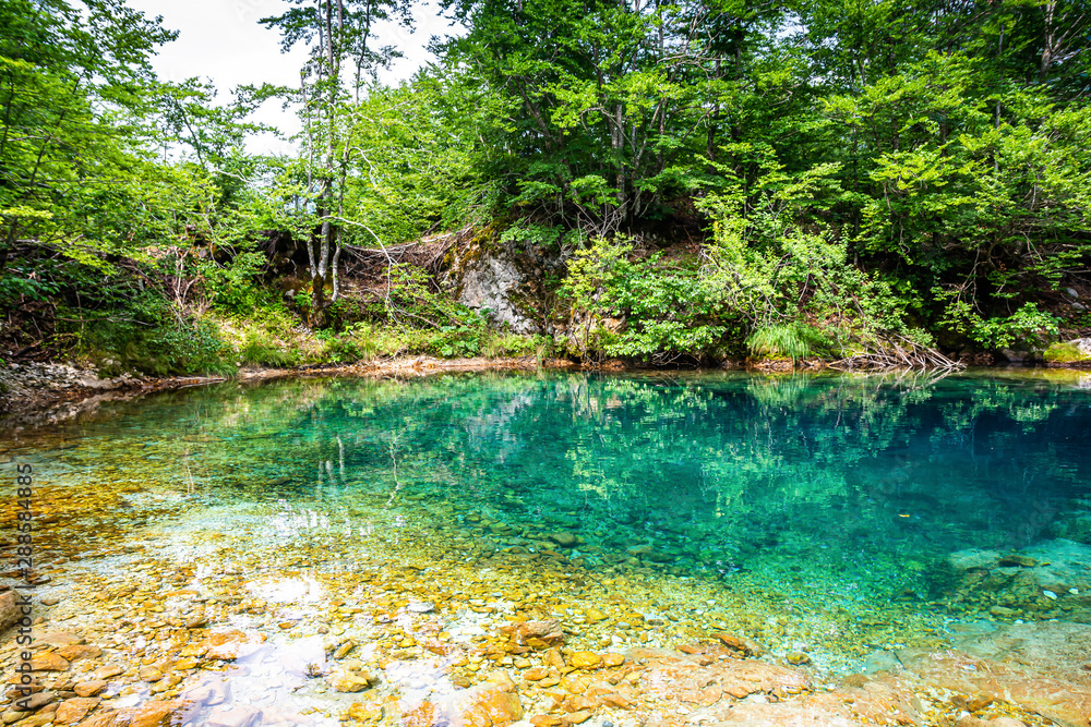 Natural blue hole karst source Oko Skakavice in Montenegro, Europe Natural blue hole karst source Oko Skakavice in Montenegro, Europe