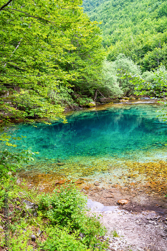 Natural blue hole karst source Oko Skakavice in Montenegro  Europe