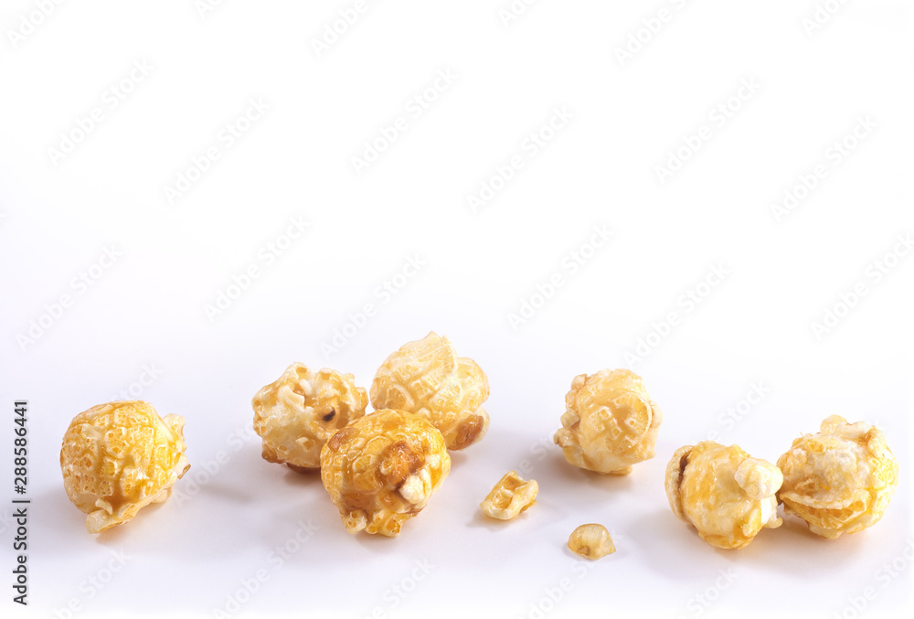 Caramel Popcorn Spilled and Isolated on White Background Caramel Popcorn Spilled and Isolated on White Background