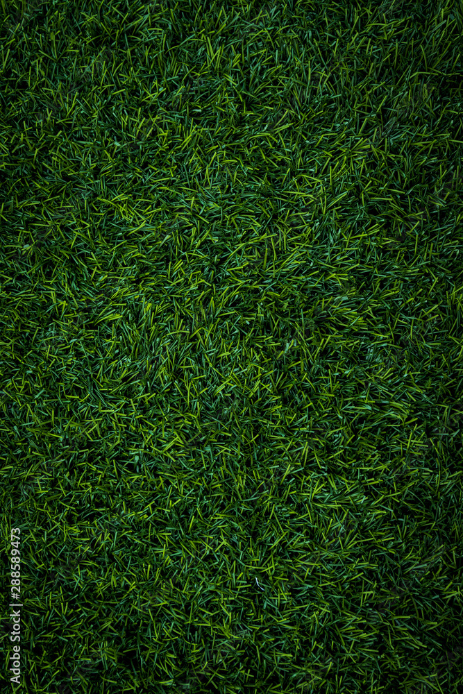 green turf of a sports field. above photo of fake grass green turf of a sports field. above photo of fake grass