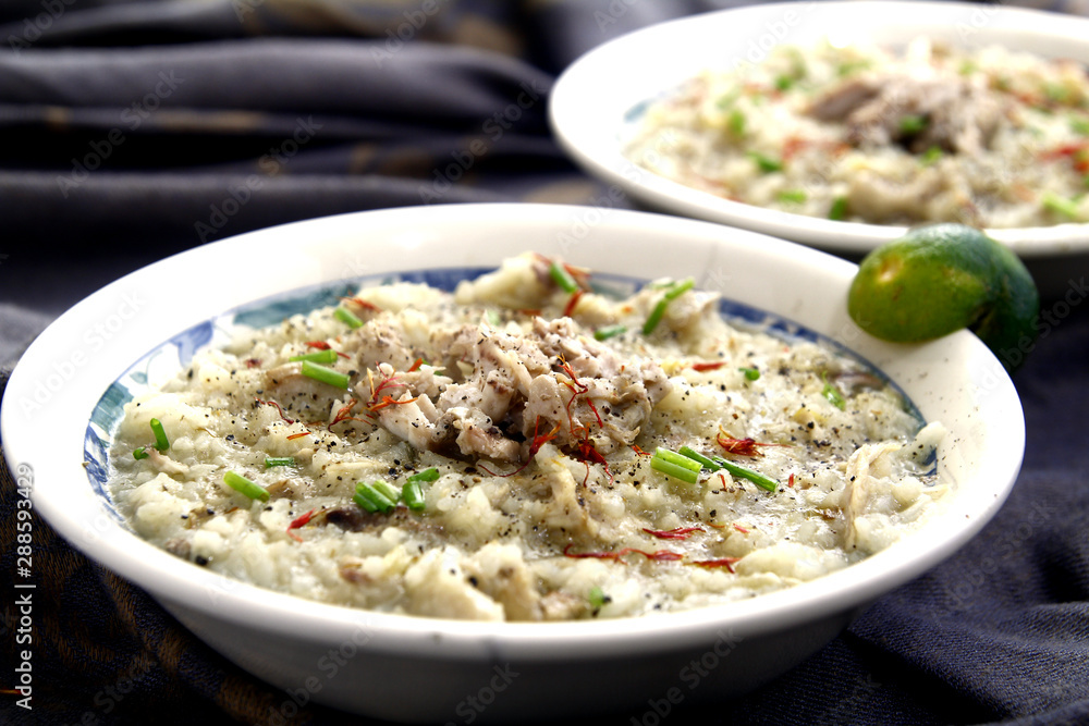 Chicken porridge also known in the Philippines as chicken lugaw or arroz caldo Chicken porridge also known in the Philippines as chicken lugaw or arroz caldo