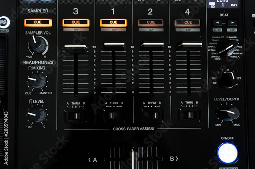 Fotografija Wide angle photo of black sound mixer controller with knobs and sliders