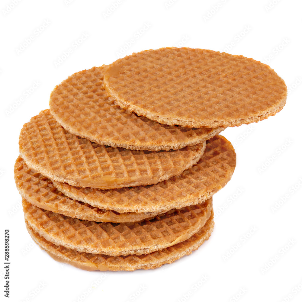Pile of round dutch waffles with caramel and honey isolated on white background. Caramel stroopwafels Side view. Close up.. Pile of round dutch waffles with caramel and honey isolated on white background. Caramel stroopwafels Side view. Close up..