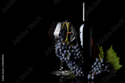 bottle and glass of red wine