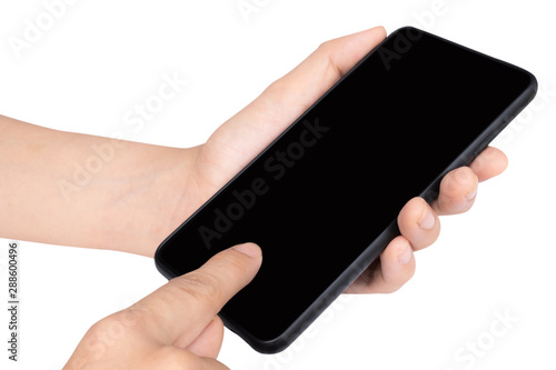 Close up adult woman hand holding and touching screen on the modern black smartphone mock up in vertical position with blank screen isolated on white background with clipping path.