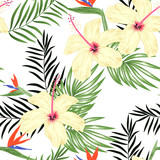 Tropical seamless pattern with palm leaf hibiscus and bird of paradise