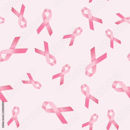 Breast cancer awareness seamless pattern of pink ribbon on pink background.