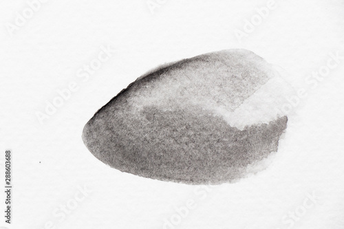 Black color watercolor handdrawing as brush or banner on white paper background © bankrx