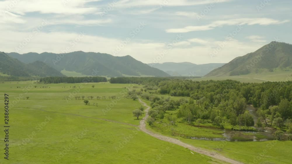 4K resolution, aerial drone at 29 frames per second over mountain in National Park with cloudy skies. Altai. Russia. 4K resolution, aerial drone at 29 frames per second over mountain in National Park with cloudy skies. Altai. Russia.
