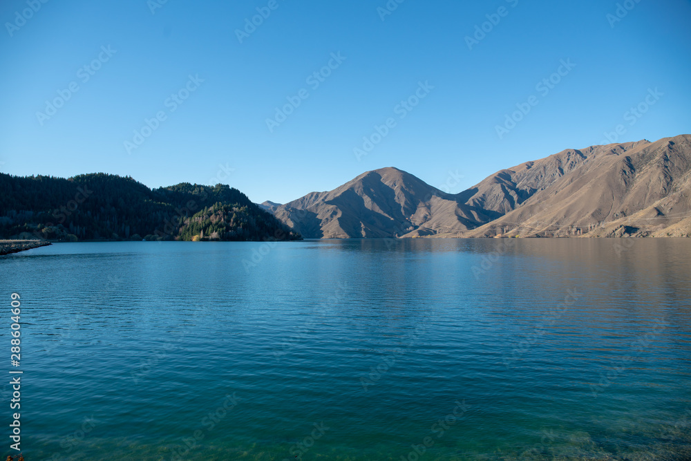 Beautiful serene glacial lake with a backdrop of the majestic southern alps of New Zealand