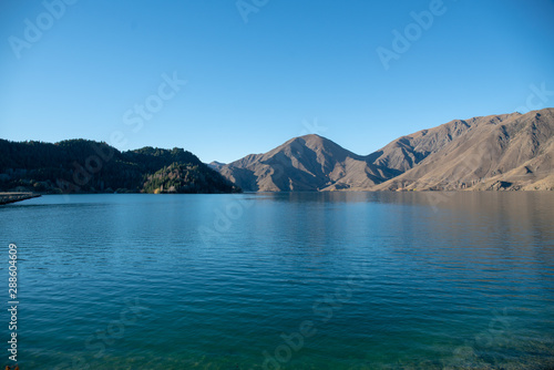 Beautiful serene glacial lake with a backdrop of the majestic southern alps of New Zealand