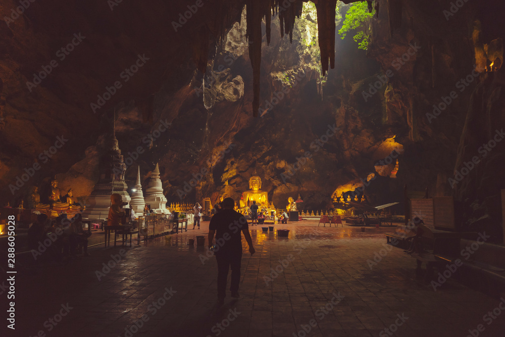 The golden Buddha inside Khao Luang Cave in Phetchaburi,Thailand