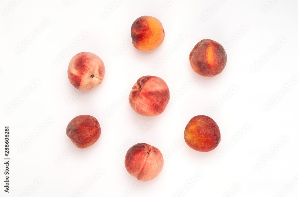 Juicy fresh peaches in the shape of a circle on a white background. Sweet peaches. Top View. Flat lay Juicy fresh peaches in the shape of a circle on a white background. Sweet peaches. Top View. Flat lay