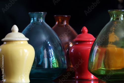 Colourful glass and ceramic containers