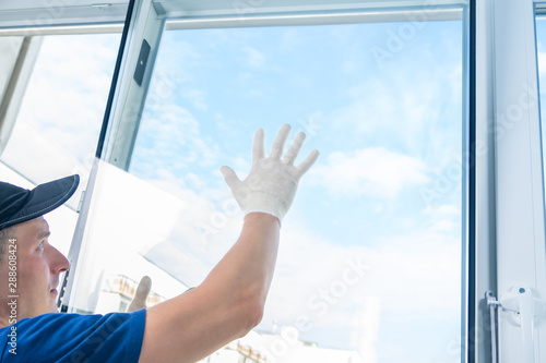 Photos installation of new plastic windows in the apartment in fine weather