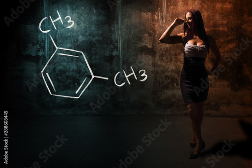 Sexy girl or secretary or female student presenting handdrawn chemical formula of M-Xylene