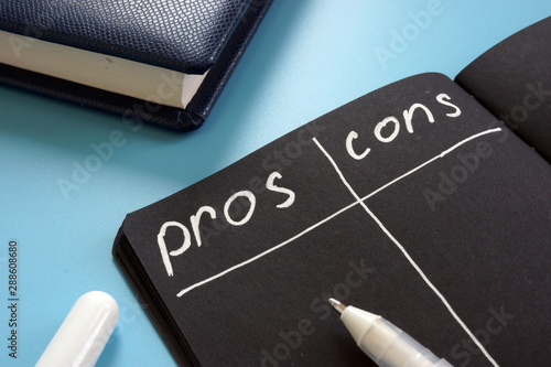 Pros and Cons list on the black page.