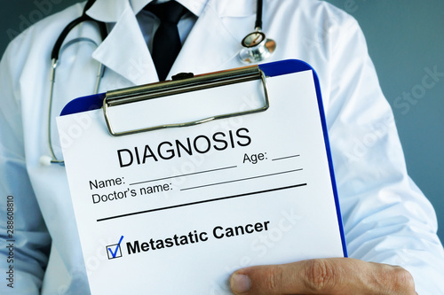 Diagnosis Metastatic cancer in a medical form with clipboard. photo