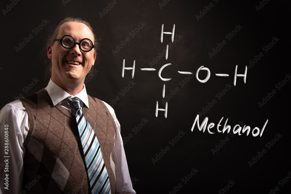 Professor presenting handdrawn chemical formula of Methanol Professor presenting handdrawn chemical formula of Methanol