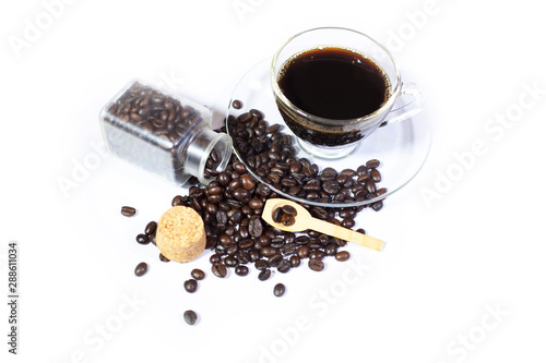 Hot coffee with coffee beans, Black coffee isolated, Roasted coffee beans in bottles, and spoon, white background photo