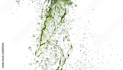 Fototapeta Naklejka Na Ścianę i Meble -  flying splashes, streams and drops of yellow and green lemonade hovered in the air on a white background