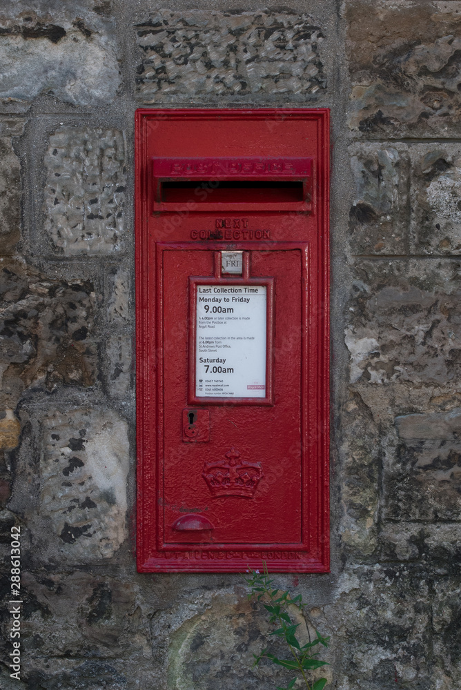old red traditional post box in United Kingdom old red traditional post box in United Kingdom