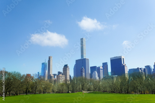 Clouds over New York skyline panorama and lawn