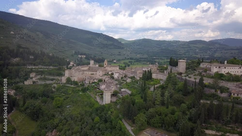 Drone aerial video of the small ancien Spello village, in Umbria region, Italy at summer season. Drone aerial video of the small ancien Spello village, in Umbria region, Italy at summer season.