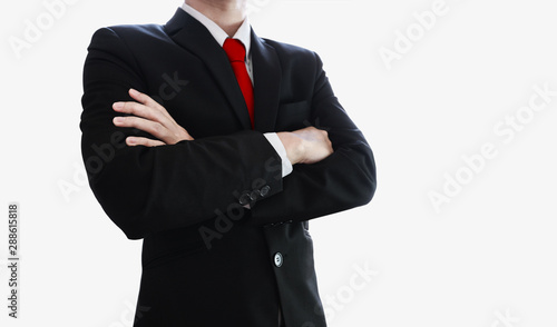 Businessman with red necktie and arm crossed, isolated on white background