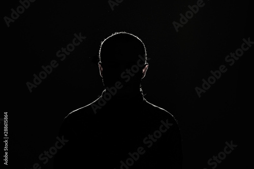 Принти на полотні silhouette: guy on black background