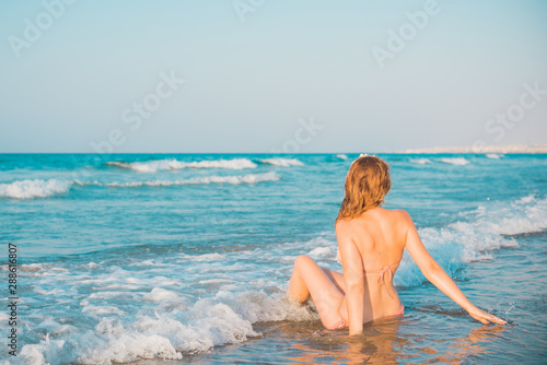 Freedom concept, redhead woman rest at sea, vacation and holidays time
