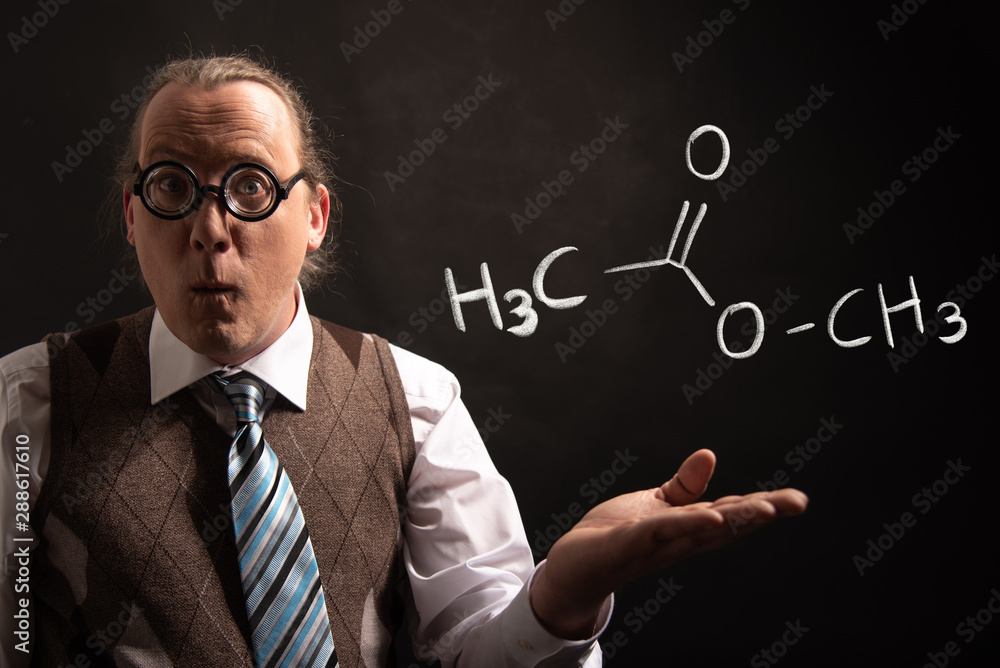 Professor presenting handdrawn chemical formula of methyl acetate