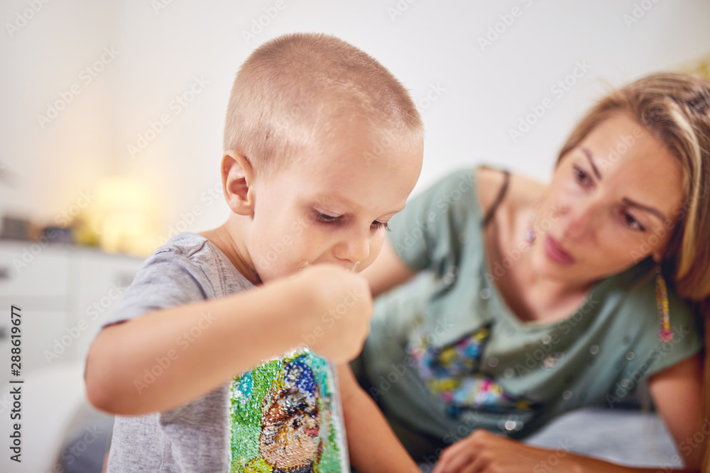 Kid eating ice-cream in the living room and making mess. Kid eating ice-cream in the living room and making mess.
