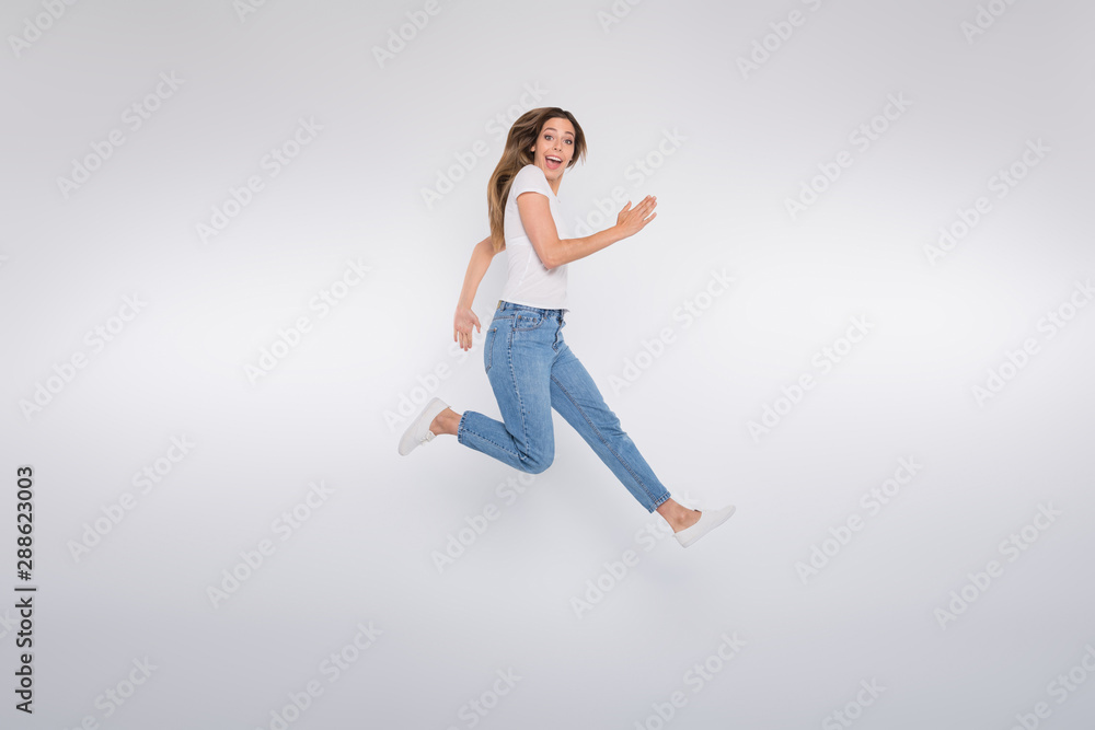 Full length body size photo of girlfriend running forward looking into camera while isolated with white background Full length body size photo of girlfriend running forward looking into camera while isolated with white background