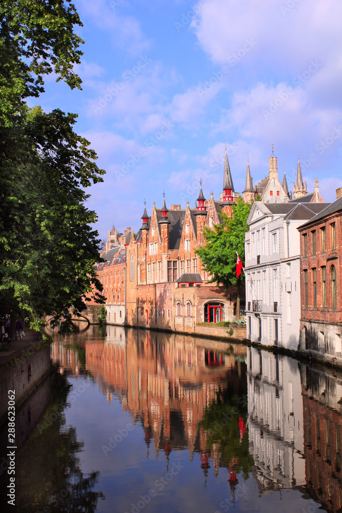 Medieval buildings along a canal in Bruges, Belgium Medieval buildings along a canal in Bruges, Belgium