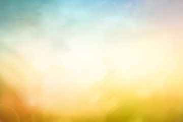 Abstract bokeh background with warm yellow and cool blue light leak for graphic design