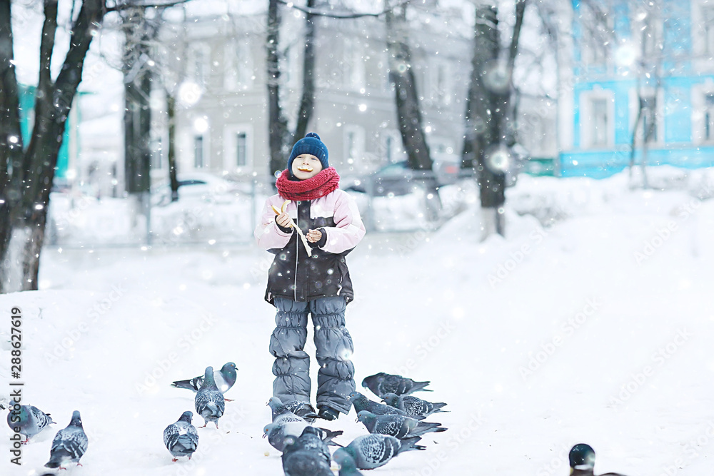 girl in winter for a walk in the park / seasonal photo of a child in warm clothes. Winter landscape with a child. Walk frost, urban style, upbringing,, christmas vacation