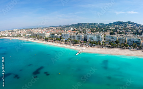 Panorama of Cannes, Cote d'Azur, France, South Europe. Nice city and luxury resort of French riviera. Famous tourist destination with nice beach and Promenade de la Croisette on Mediterranean sea © oleg_p_100
