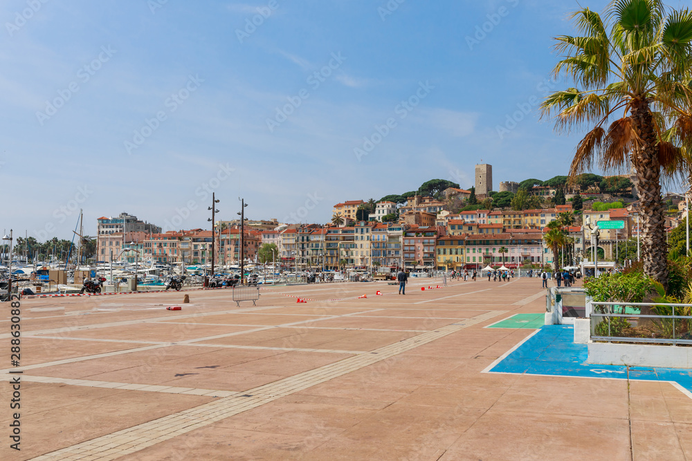 Fototapeta premium Panorama of Cannes, Cote d'Azur, France, South Europe. Nice city and luxury resort of French riviera. Famous tourist destination with nice beach and Promenade de la Croisette on Mediterranean sea
