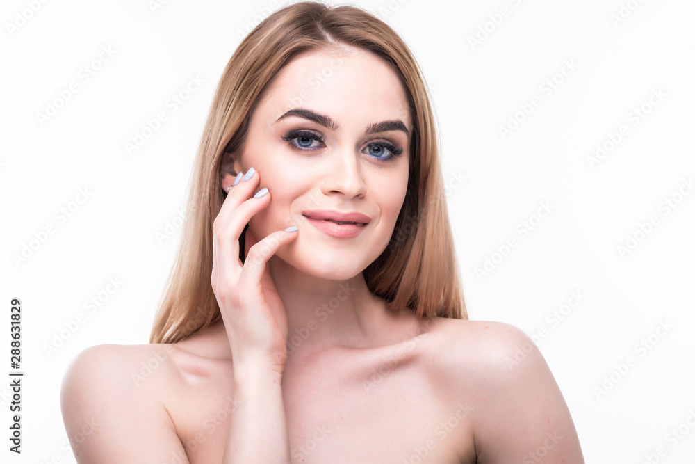 Young intimate girl with perfect and healthy skin feeling shy isolated on warm background.