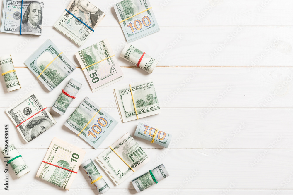 Dollar bills. Pile of one hundred US Dollar Bills money on colored background top wiev with copy space for your text in business concept