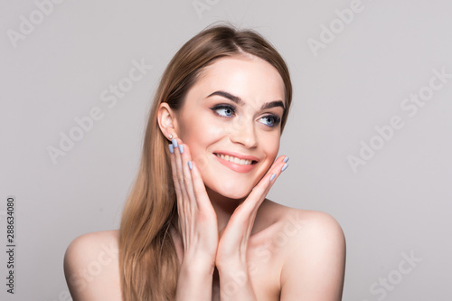 Beautiful Woman Face Portrait Beauty Skin Care Concept Beautiful beauty young female model girl touching her face skin cheeks hands fingers.