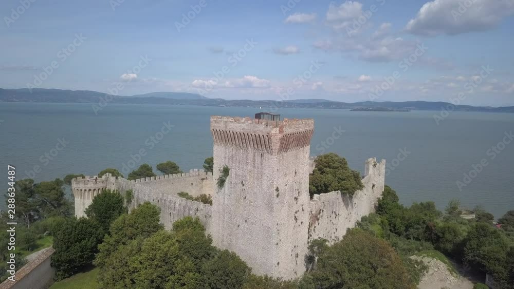 Drone aerial video of the small ancien Castiglione del Lago village, in Umbria region, Italy at summer Drone aerial video of the small ancien Castiglione del Lago village, in Umbria region, Italy at summer