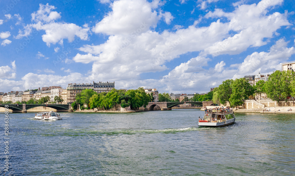 Panoramic cityscape of Seine river and Paris, France, Europe. Seine is famous tourist destination with many landmarks. View of Seine postcard in Paris