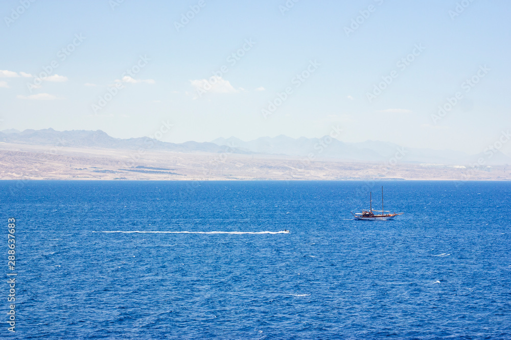 Pleasure yacht in the Red Sea against the mountains